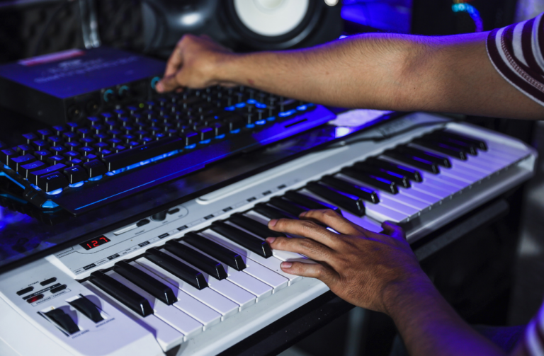 Professional TV ad music production studio in the Philippines with high-end audio monitors and instruments.