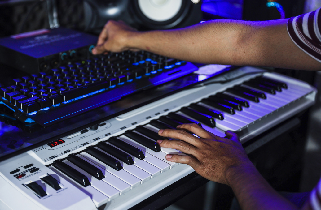 Professional TV ad music production studio in the Philippines with high-end audio monitors and instruments.