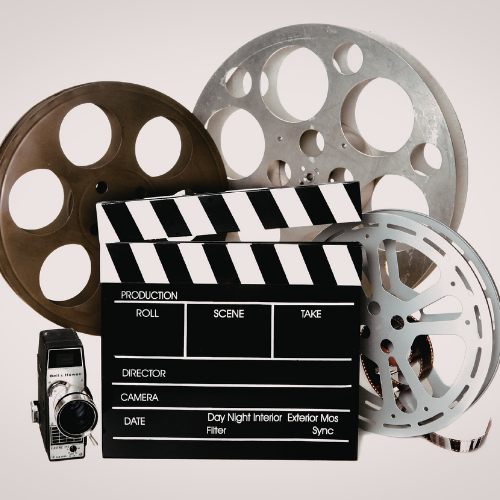 Film reel, clapperboard, and vintage camera representing film and short film music composition